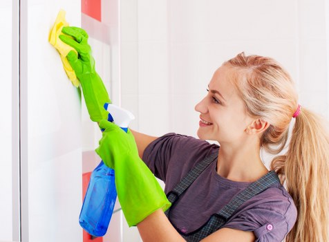 Professional carpet cleaner in Barnes restoring a bright living room carpet