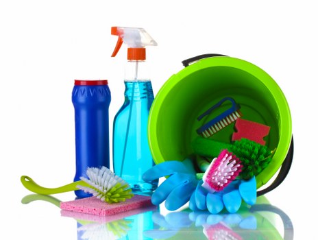 Cleaner preparing carpet cleaning equipment for a booked service