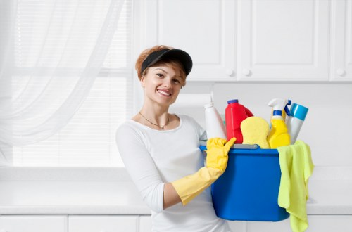 Professional cleaner maintaining a modern office workspace